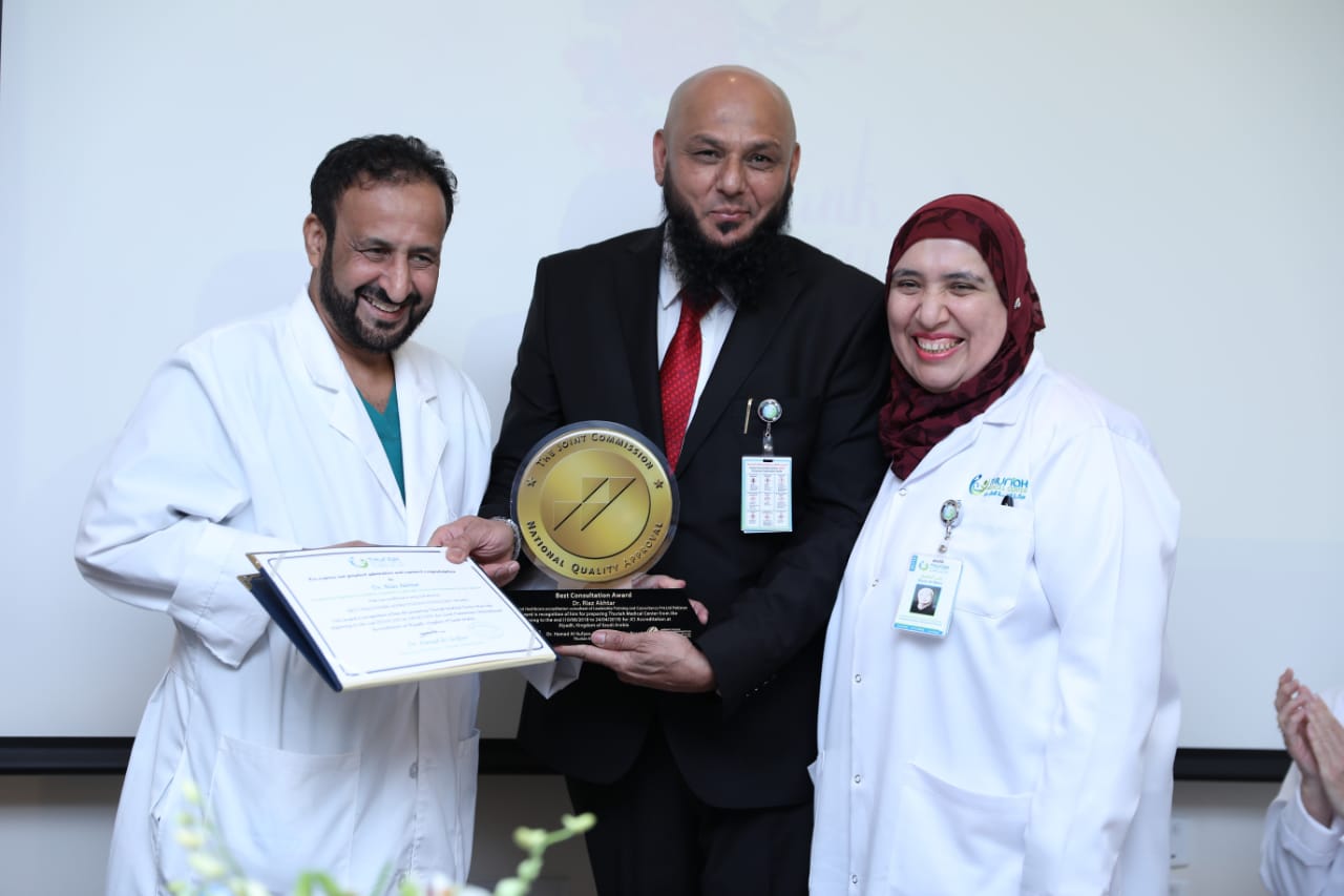 LTC leadership receiving a healthcare accreditation award